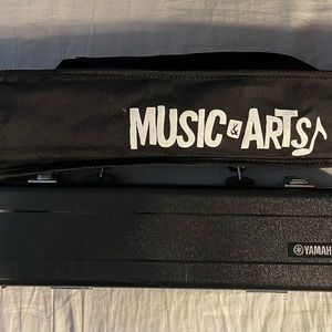 Old music to my ears!!! Like new, Yamaha flute and on stage stand.